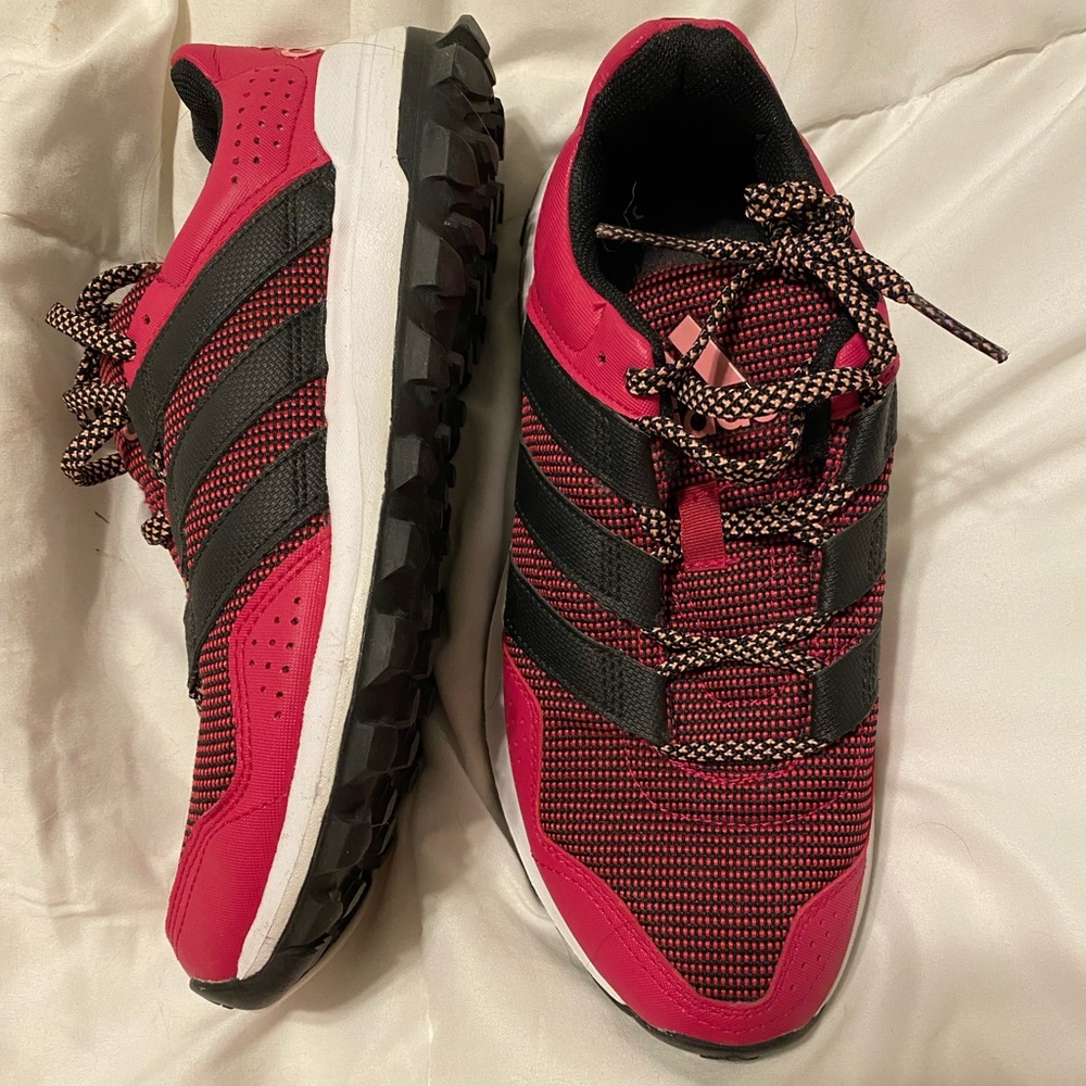 Pink women’s Adidas running shoes
